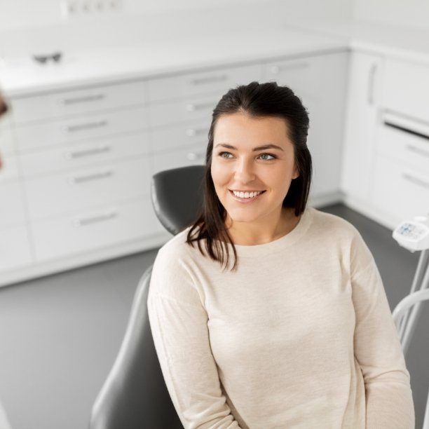 Woman smiling during dental checkup visit