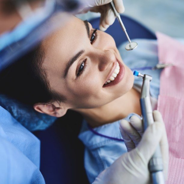 Woman receiving professional dental cleaning