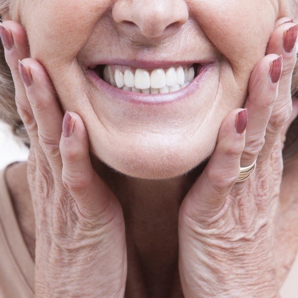 Closeup of smiling patient enjoying the benefits of dental implants