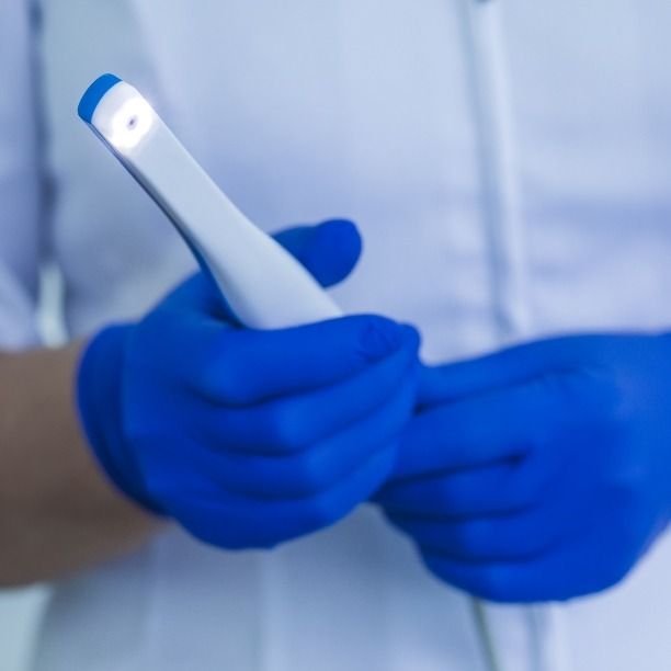 Dentist holding an intraoral camera