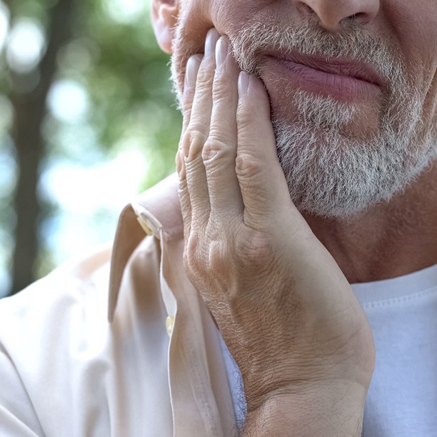 Close-up of a man with tooth pain