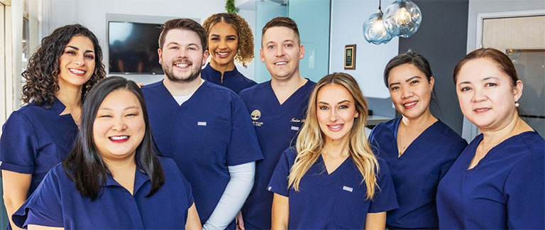 Smiling Plano Texas dentist and dental team members at Westpark Village Dental Care