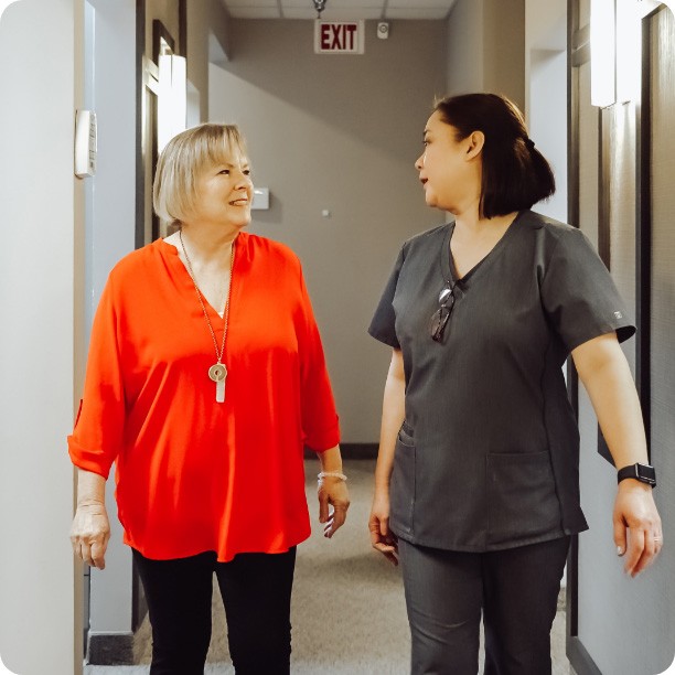 Plano dental team member talking to dental patient