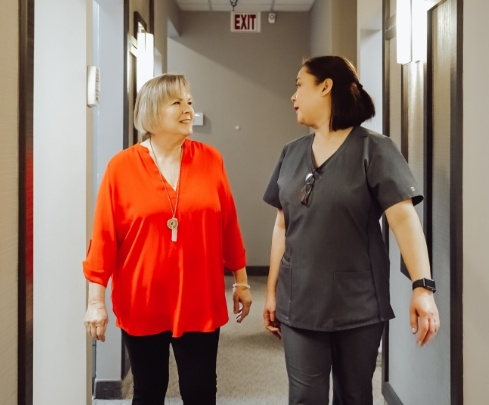 dental team member talking to patient