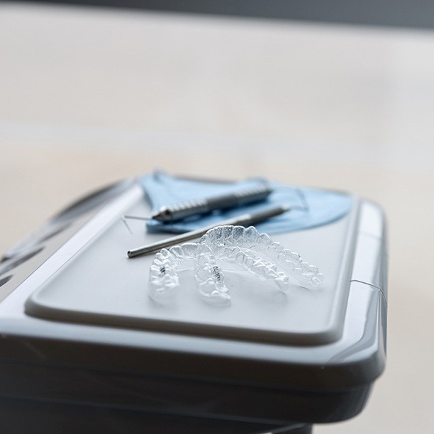 CandidPro clear aligners sitting on a dental tray in a dental office