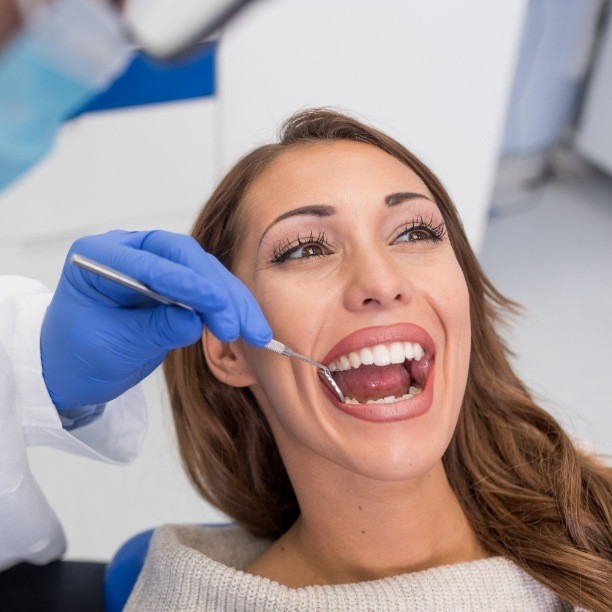 Dental patient receiving preventive dentistry checkups and teeth cleanings