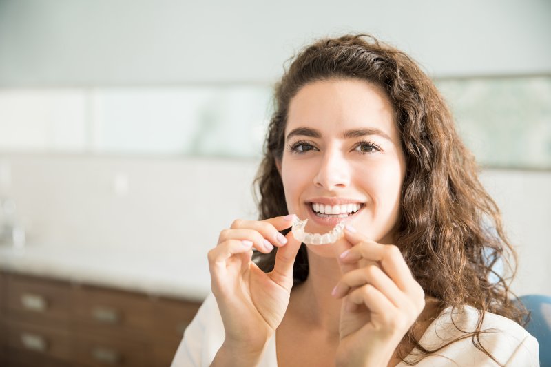 woman with a clear aligner