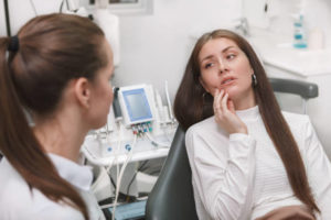 Woman at dentist for dental pain