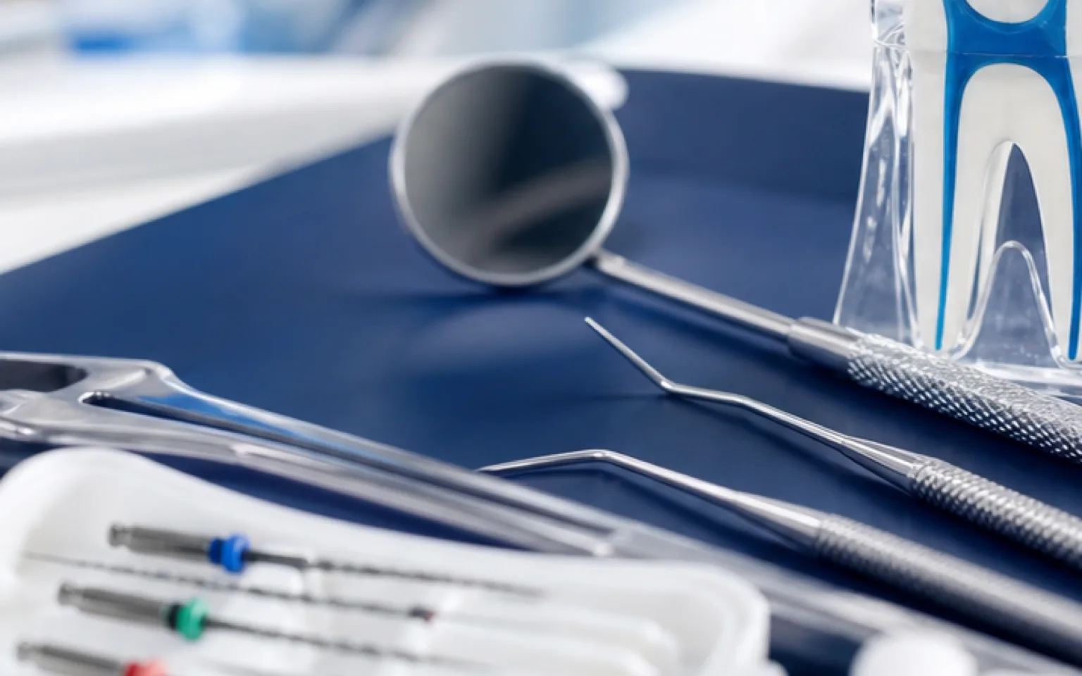 Illustration of dental instrument being used to perform root canal therapy