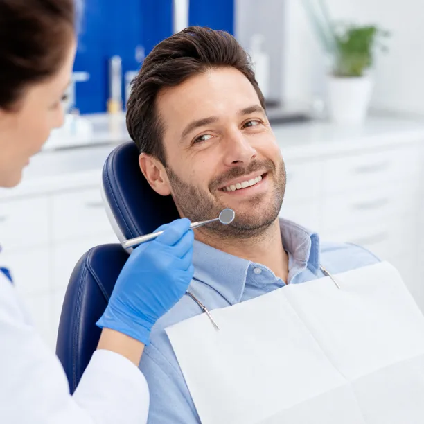 Woman smiling during dental checkup visit