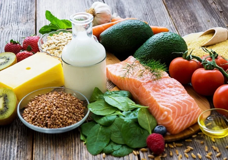 A selection of healthy foods against a wooden background