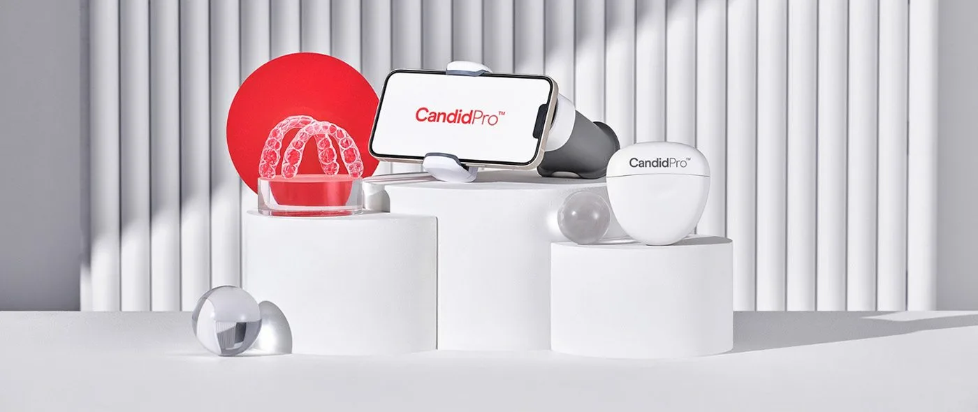 CandidPro clear aligners, case, and ProMonitoring app on display